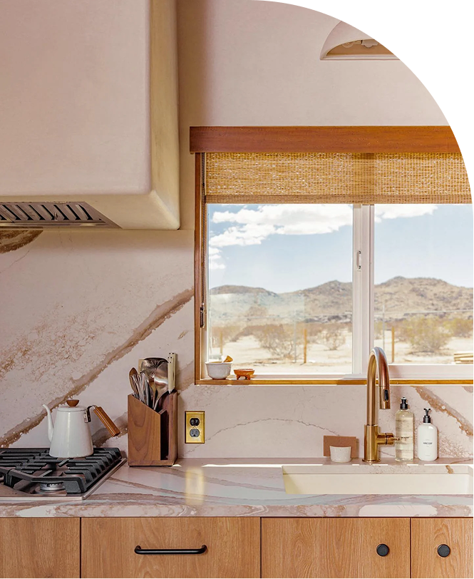 Modern kitchen with wooden cabinets and mountain view