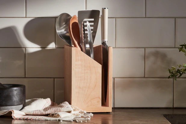 Kitchen utensil set hanging on rack